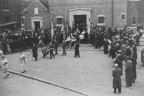 Photograph of the Mourners coming out of the Church of St Willibrord, Eisden